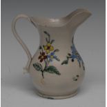 An 18th century English saltglazed baluster cream jug,