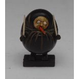 A Japanese Kobe toy, carved as a grotesque figure with protruding eyes and tongue, 4.