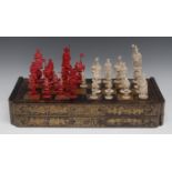 A 19th century Cantonese ivory figural chess set, each piece with a puzzle ball to base,