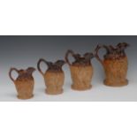 A graduated set of four late 19th century London brown salt glazed stoneware Silenus jugs,