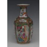 A Chinese Cantonese Famille Rose ovoid vase, decorated alternating panels of figures, flowers,