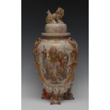 A Japanese Satsuma vase and cover, decorated with deities and elders in a sunken reserve,