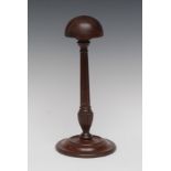 A George III mahogany table wig stand, domed top, turned reeded and fluted pillar, circular base,