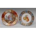 A Sevres Chateau des Tuileries circular plate, painted with courting couple in woodland,