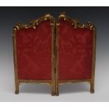 A Louis XV style giltwood two-fold table screen, leafy scroll carved cresting, 46cm high,