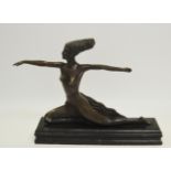 An Art Deco figure of a ballet dancer in a kneeling pose,