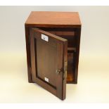 A 19th century mahogany cabinet, field paneled door, 29.5cm high, c.