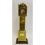 A free-standing brass-cased miniature clock, Roman numerals, inscribed 'Ansonia',