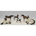 A Beswick Siamese cat reclining, another; a Beswick bay horse, swished tail, another,