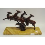 A French Art Deco model of prancing Deer, marble base, brass plaque dated 1939.