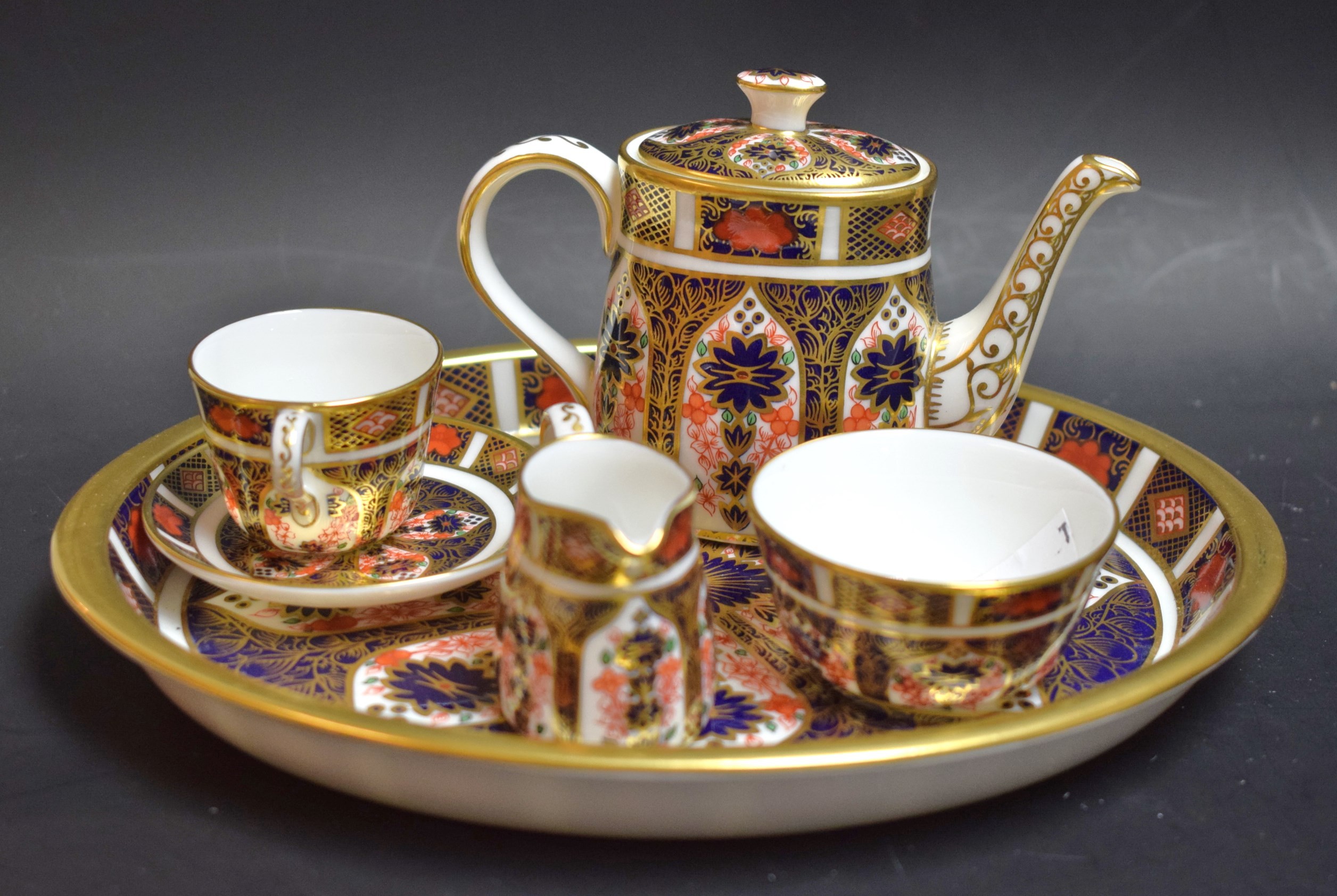 A Royal Crown Derby 1128 pattern miniature tea service on tray