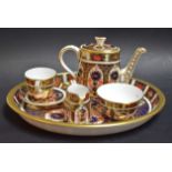 A Royal Crown Derby 1128 pattern miniature tea service on tray