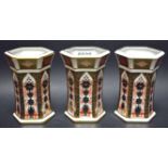 Two Royal Crown Derby flared octagonal vases, printed marks (firsts); another,