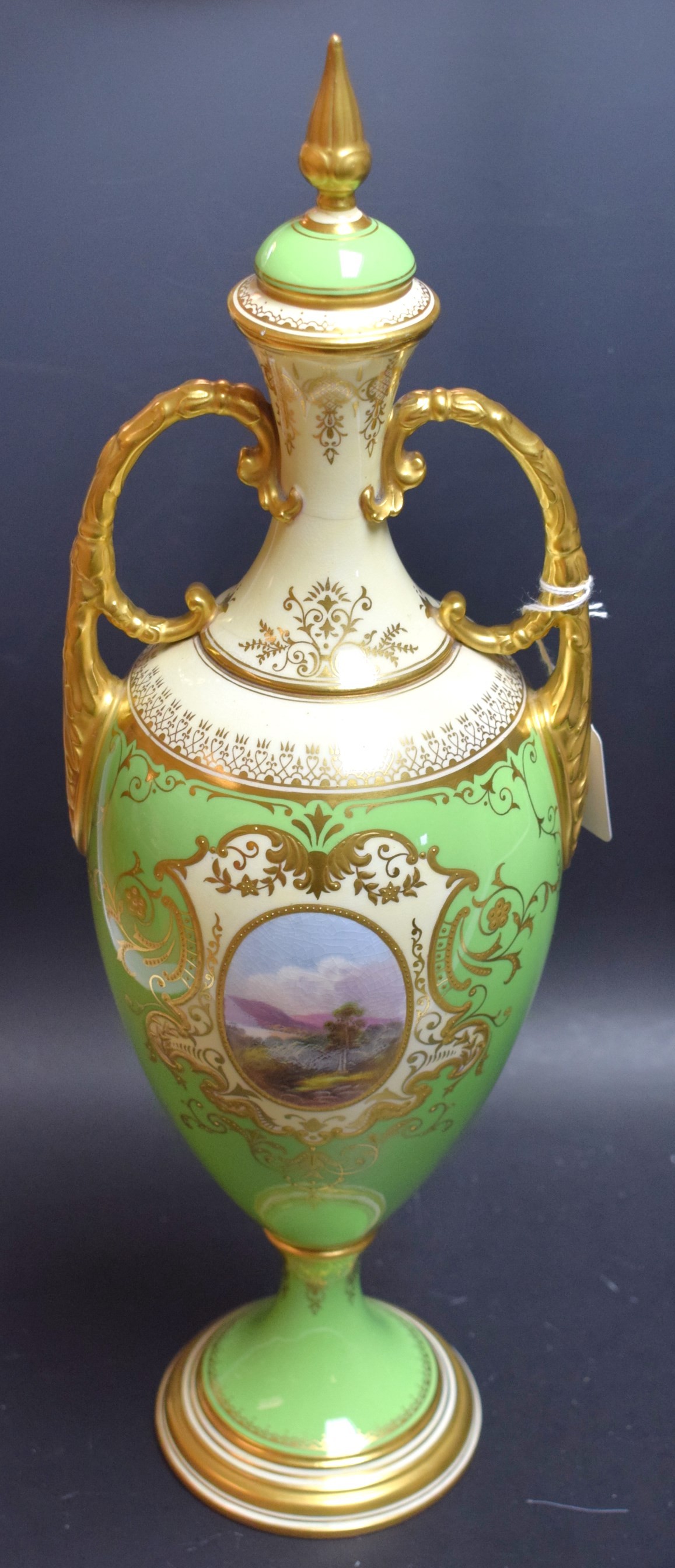 A Coalport two handled pedlesta vase with cover,