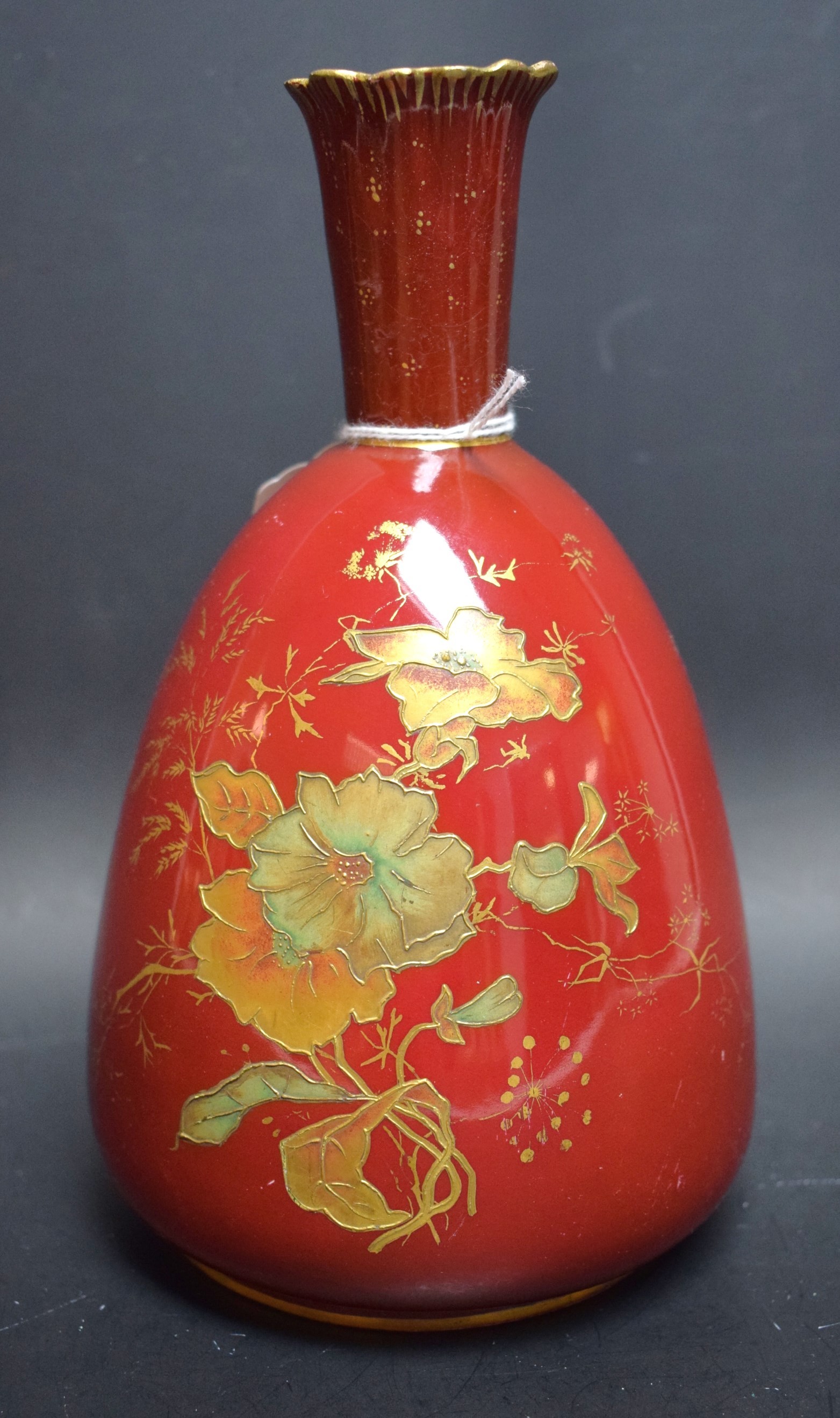 A Derby Crown Porcelain mallet shaped vase, gilt floral design, red body,