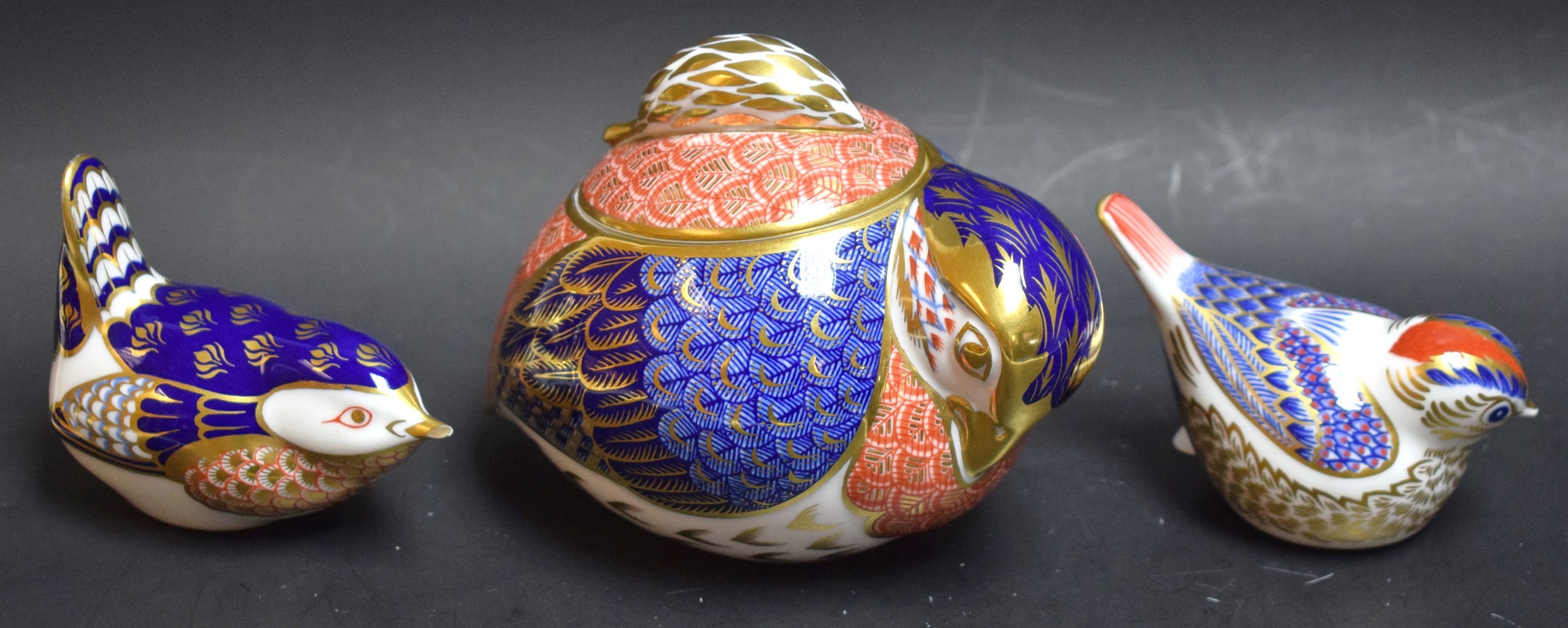 A Royal Crown Derby Quail sucrier and cover, second quality; a Royal Crown Derby paperweight,