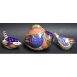 A Royal Crown Derby Quail sucrier and cover, second quality; a Royal Crown Derby paperweight,