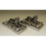 A pair of 19th Century chrome plated lion desk weights
