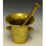 A brass pestle and mortar