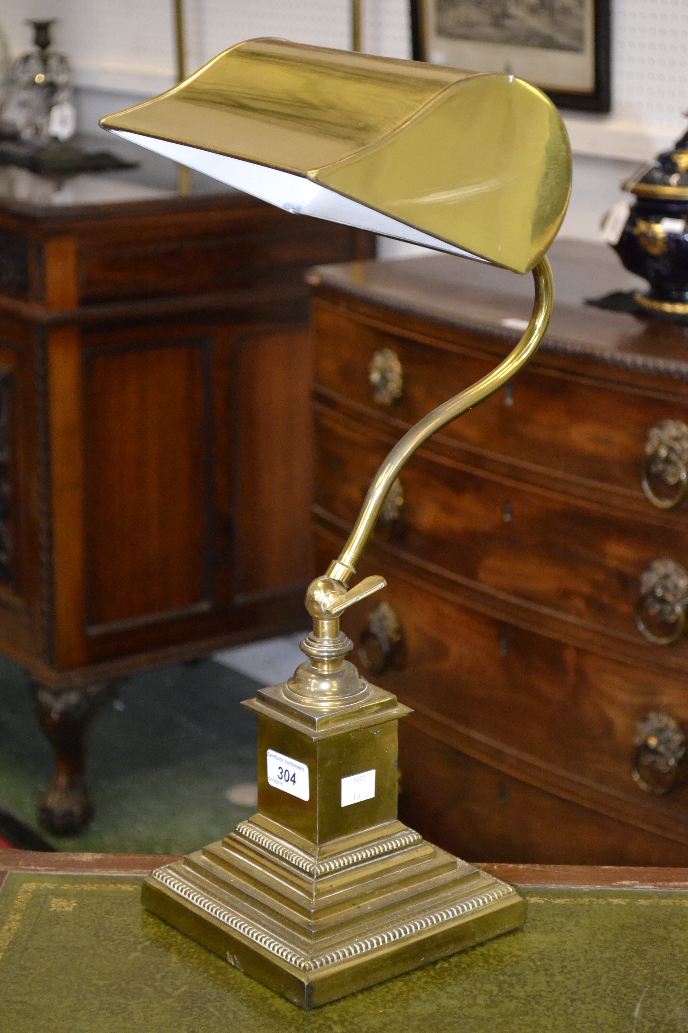 A heavy brass desk lamp
