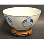 A Chinese circular bowl, painted in underglaze blue with five stylised bats,