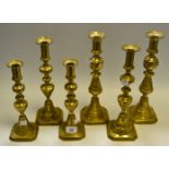 A set of four Victorian turned brass candlesticks,