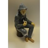 A Nao model of an elderly Fisherman smoking a pipe,