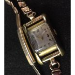 Omega - a lady's wristwatch, square silvered dial, Arabic numerals, minute track,