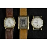 A 1930s 9ct gold tank watch, silvered dial, Arabic numerals, minute track, subsidiary seconds,