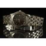 Gucci - a diamond and stainless steel ladys 5500L bracelet watch, black dial, diamond batons.