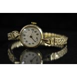 Tudor Rolex - a retro lady's 9ct gold bracelet watch, textured silvered dial, Arabic numerals,