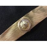 A vintage Duward King lady's bracelet watch, circular silvered dial, quartered Arabic numerals,