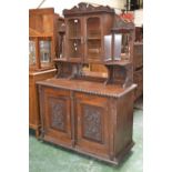 A late Victorian sideboard, shaped and carved pediment,