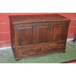 A stained oak mule chest, hinged panelled top, three fielded panels over two drawers to front,