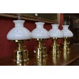 Four contemporary table oil lamps by E.S.Sorensen, Kobenhaven, Danmark serial nos.