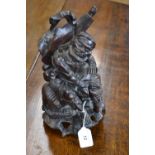 A Chinese hardwood carving, of a sage seated on an elephant, 31cm high,