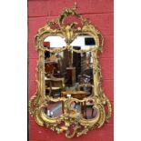 A 20th ornate gilt wall mirror,