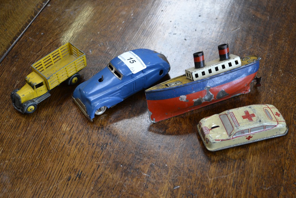 An early to mid 20th century tin plate toy steam boat with winding mechanism;