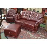 A late 20th century oxblood leather four piece suite,