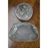 An Art Nouveau pewter tray cast with stylised birds perched on fruiting vines,