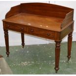 A Victorian mahogany writing desk, three quarter gallery, moulded oversailing top,