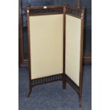 An Edwardian two section folding modesty screen, fabric panels, mahogany frame, c.