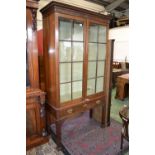 A regency style mahogany bookcase, on stand,