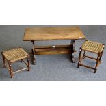 A 20th century oak trestle coffee table; two oak rope seated stools.