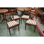 A set of four 20th century Regency style dining chairs