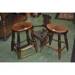 Two oak stools circa 1880; an apprentice piece doll's armchair with wickerwork back and seat.