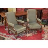 A pair of Victorian Gentleman's and Ladies arm chairs, scroll back, turned supports, turned legs,