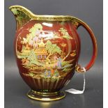 A Crown Devon Fieldings ovoid jug, rouge royale type lustre glaze, applied with pagoda,