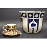 A Royal Crown Derby 1128 coffee can and saucer;