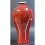 An inverted baluster vase,